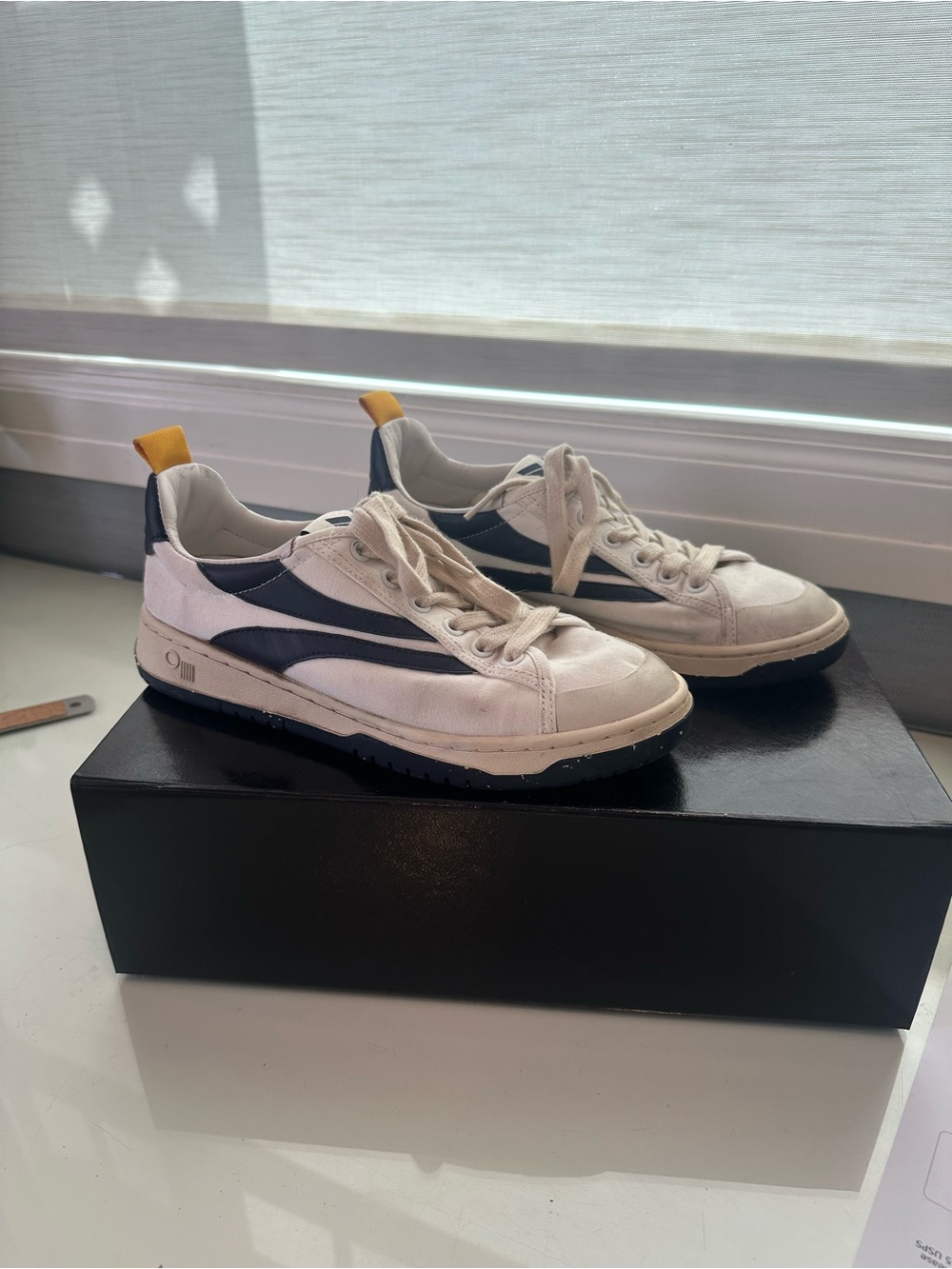 Women's White and Navy Low-Top Sneakers with Yellow Pull Tab